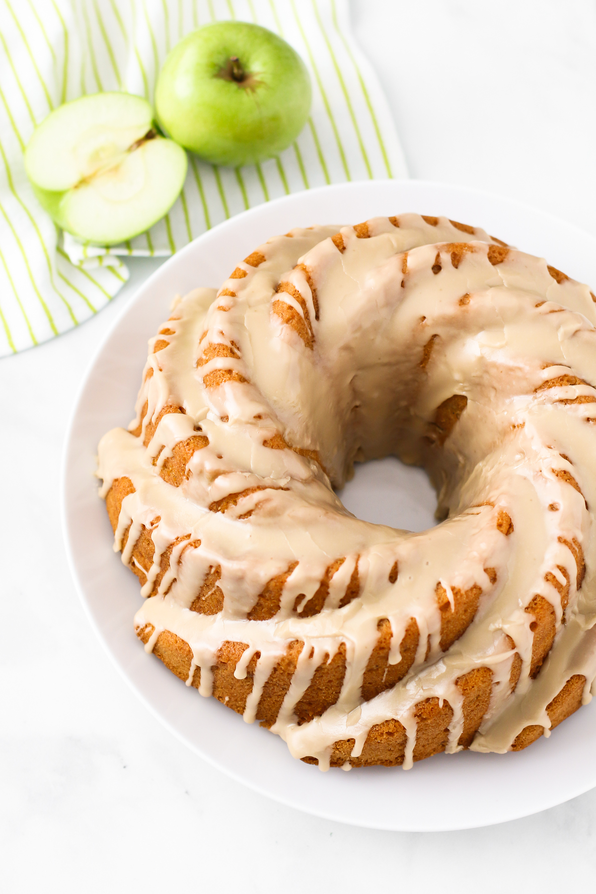 Gluten Free Vegan Caramel Apple Bundt Cake. As the decadent caramel glaze is dripping down the sides of this gluten free vegan caramel apple bundt cake, you can’t help but want a slice.