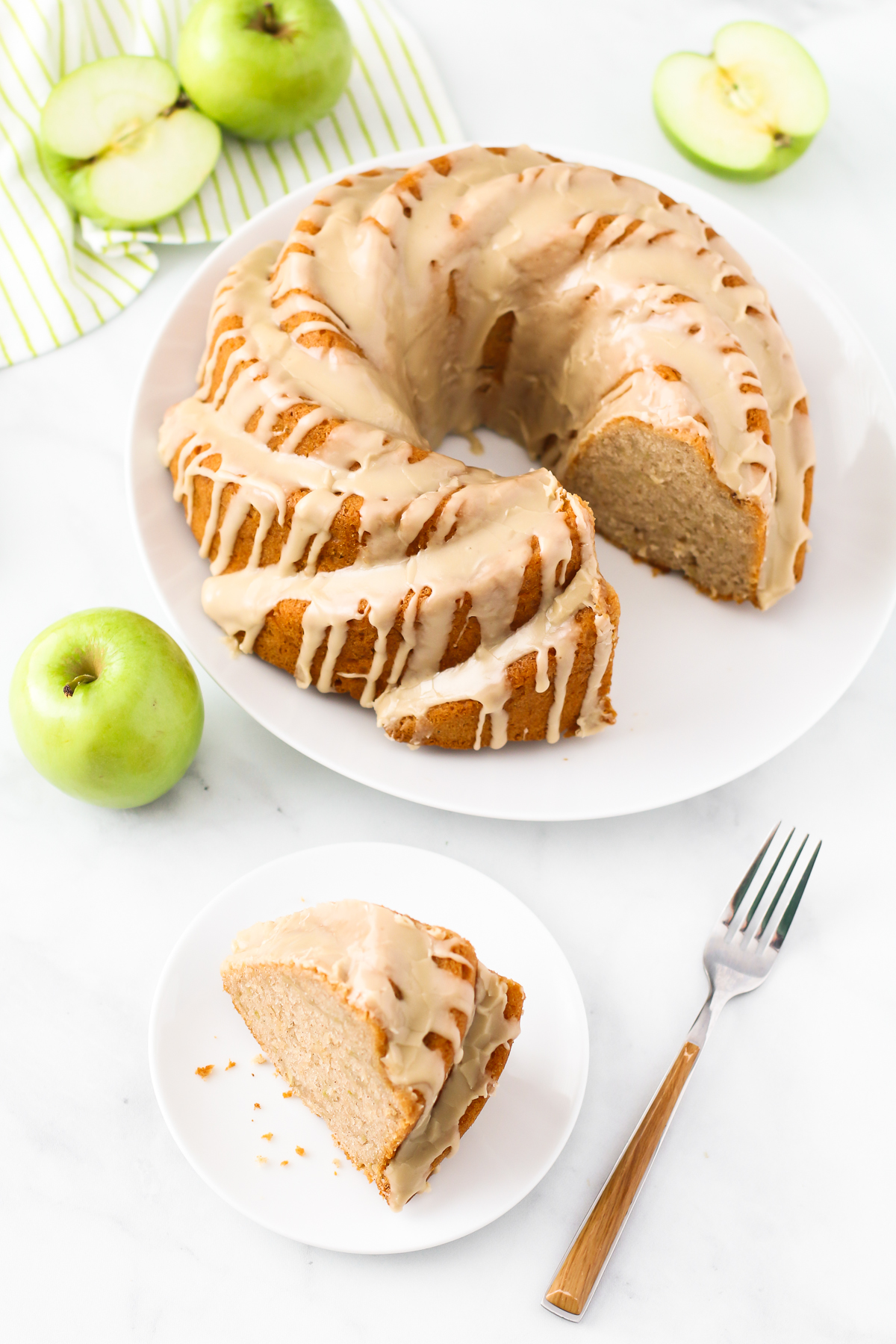 Gluten Free Vegan Caramel Apple Bundt Cake. This tender apple bundt cake, covered in a caramel glaze, makes for one stunning fall dessert!