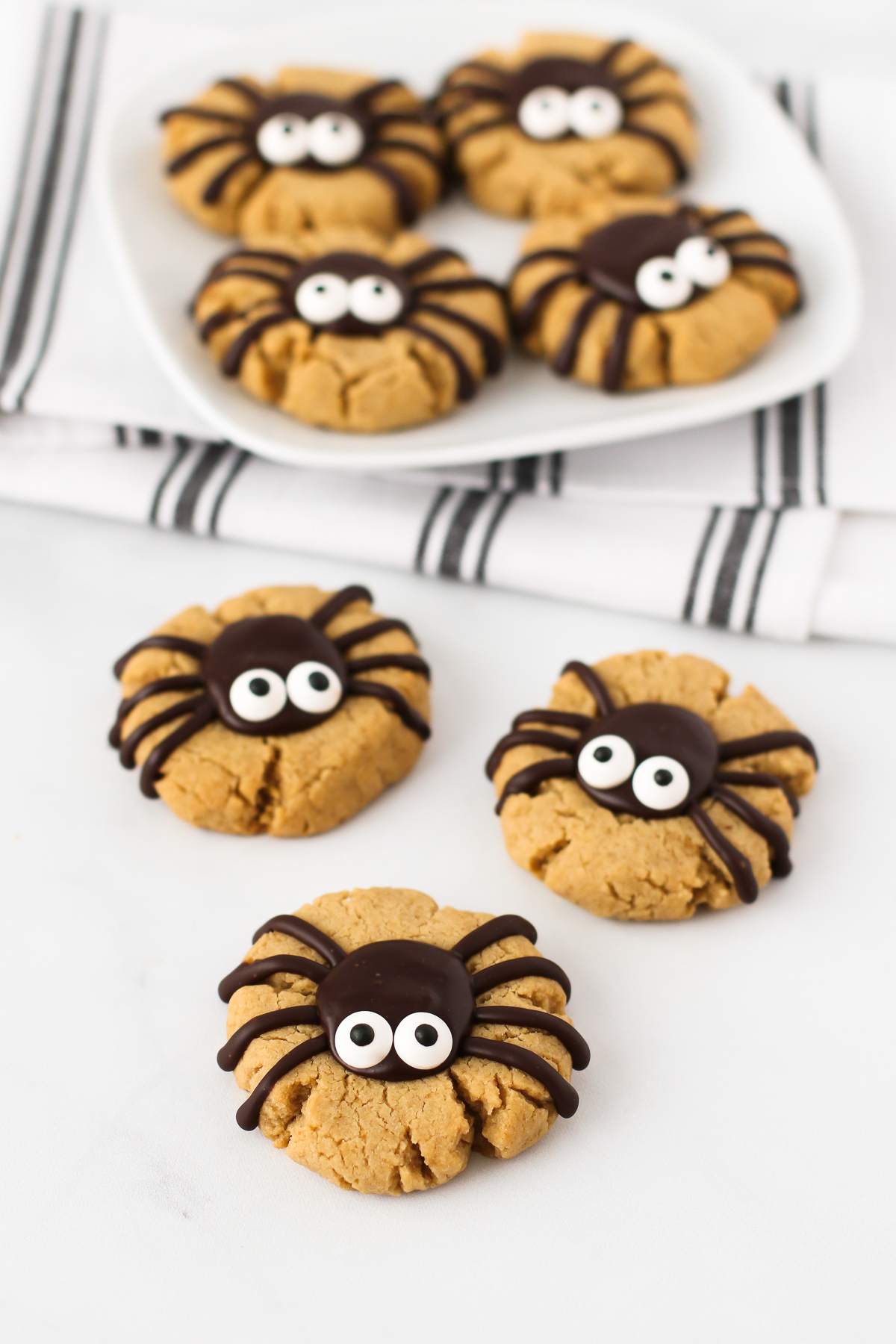 Gluten Free Vegan Peanut Butter Spider Cookies. How cute are these peanut butter thumbprint cookies, topped with a delicious chocolate spider?