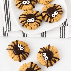 Gluten Free Vegan Peanut Butter Spider Cookies. How cute are these peanut butter thumbprint cookies, topped with a delicious chocolate spider?