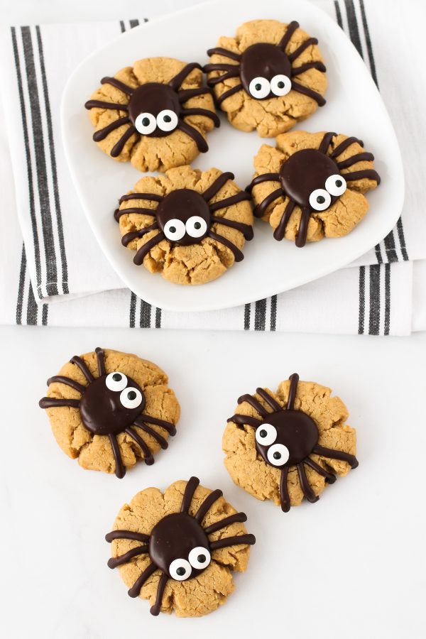 Gluten Free Vegan Peanut Butter Spider Cookies. How cute are these peanut butter thumbprint cookies, topped with a delicious chocolate spider?