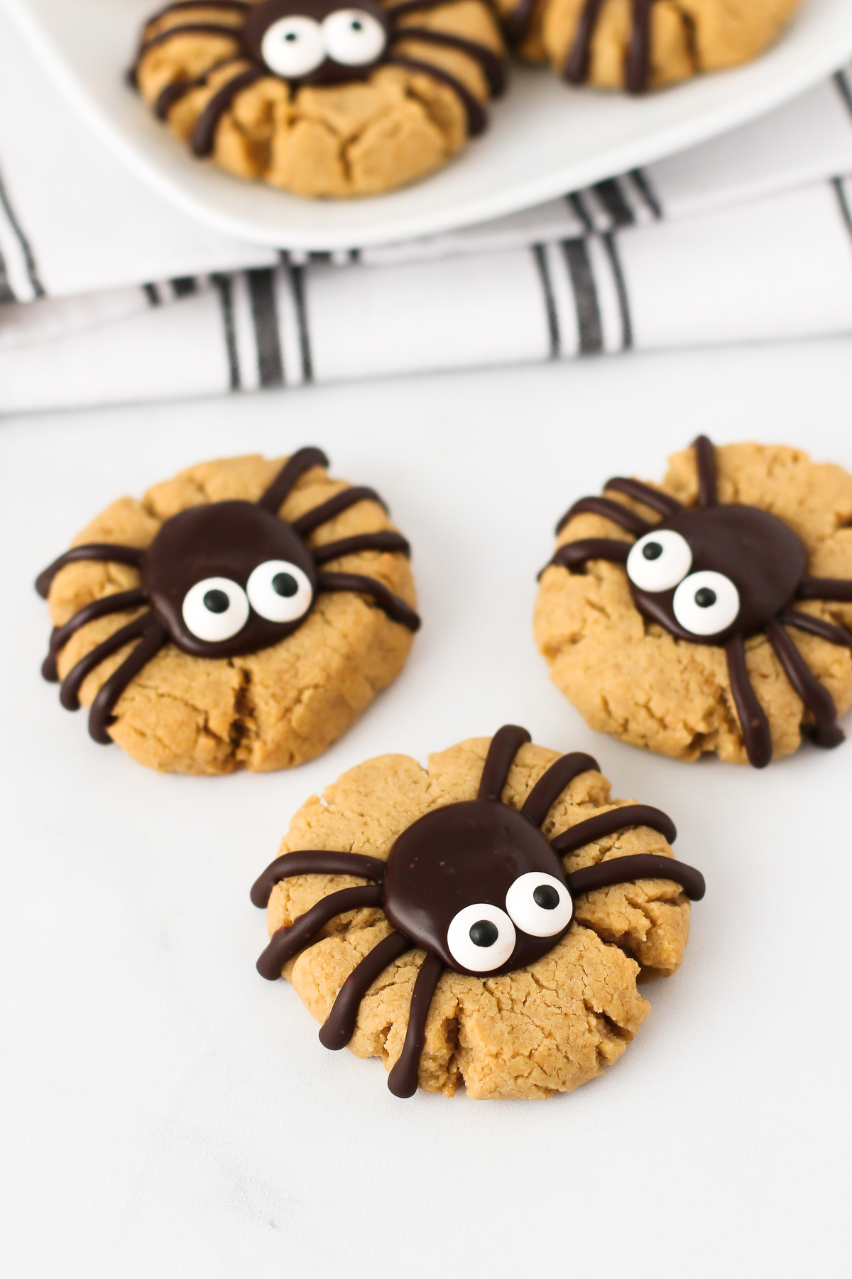 Gluten Free Vegan Peanut Butter Spider Cookies. Soft peanut butter cookies, topped with a chocolate spider. Creepy, yet so delicious!