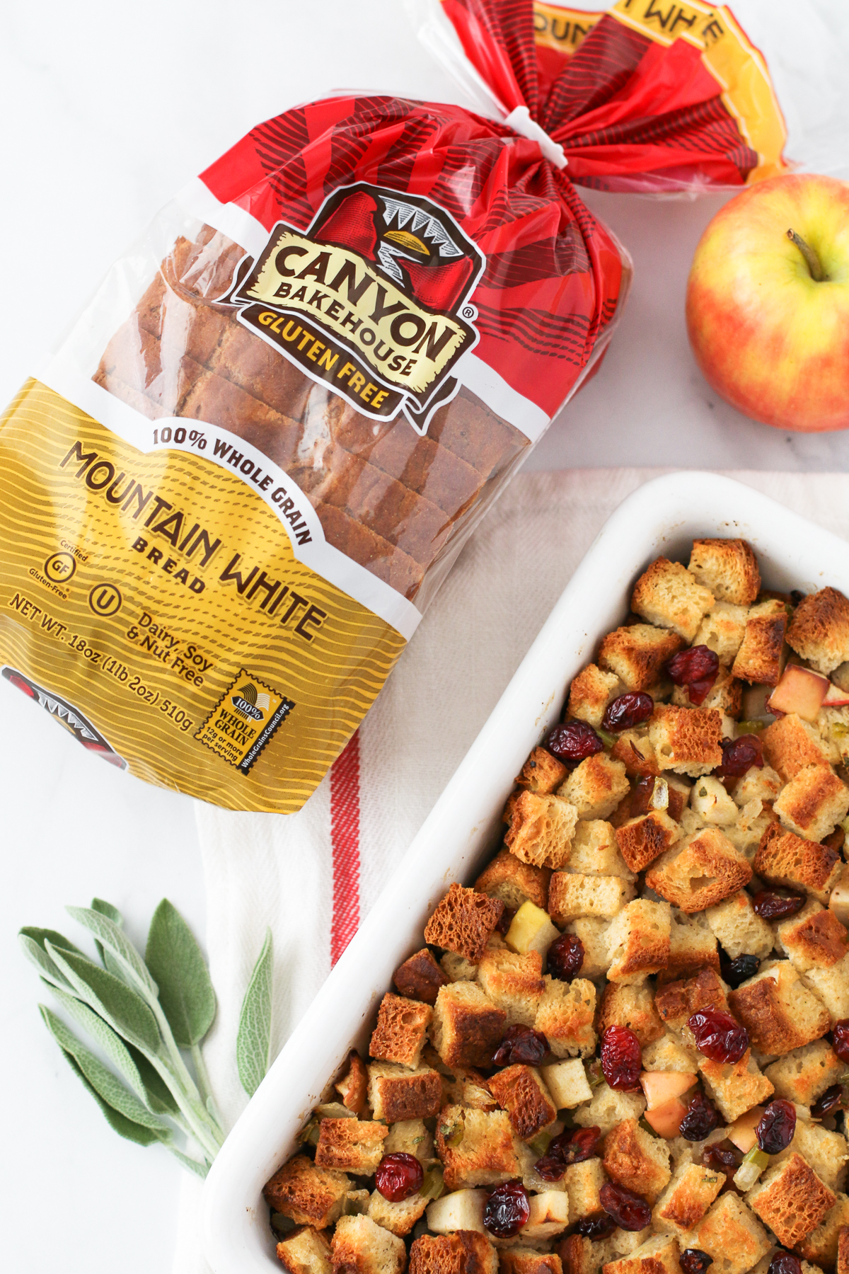 Gluten Free Apple Cranberry Stuffing. Made with Canyon Bakehouse gluten free bread, this stuffing is packed with both sweet and savory fall flavors.