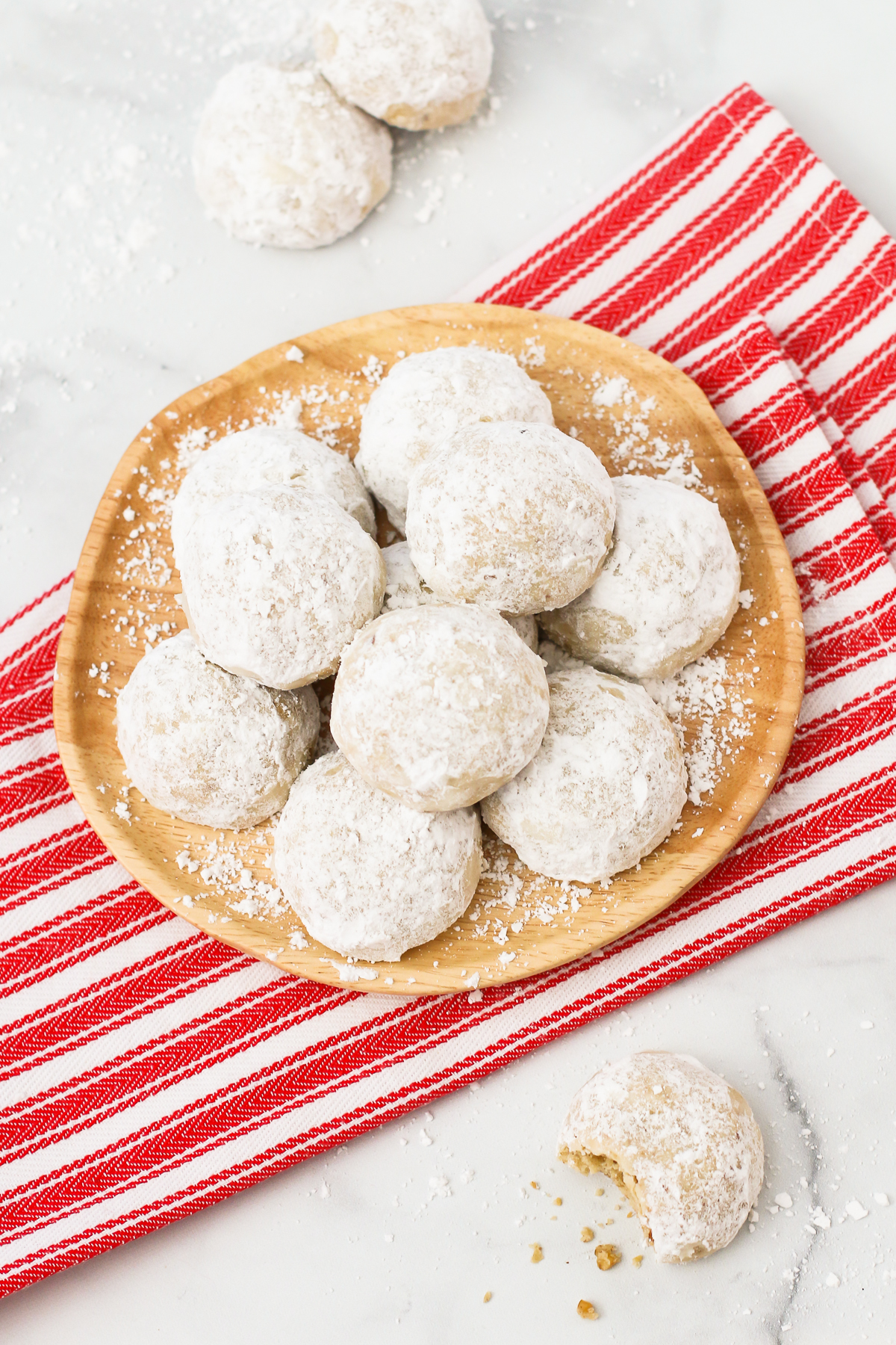 Gluten Free Vegan Snowball Cookies. Also known as Russian tea cakes, these powdered sugar coated cookies are made with flavorful toasted walnuts. A buttery, simple holiday cookie!