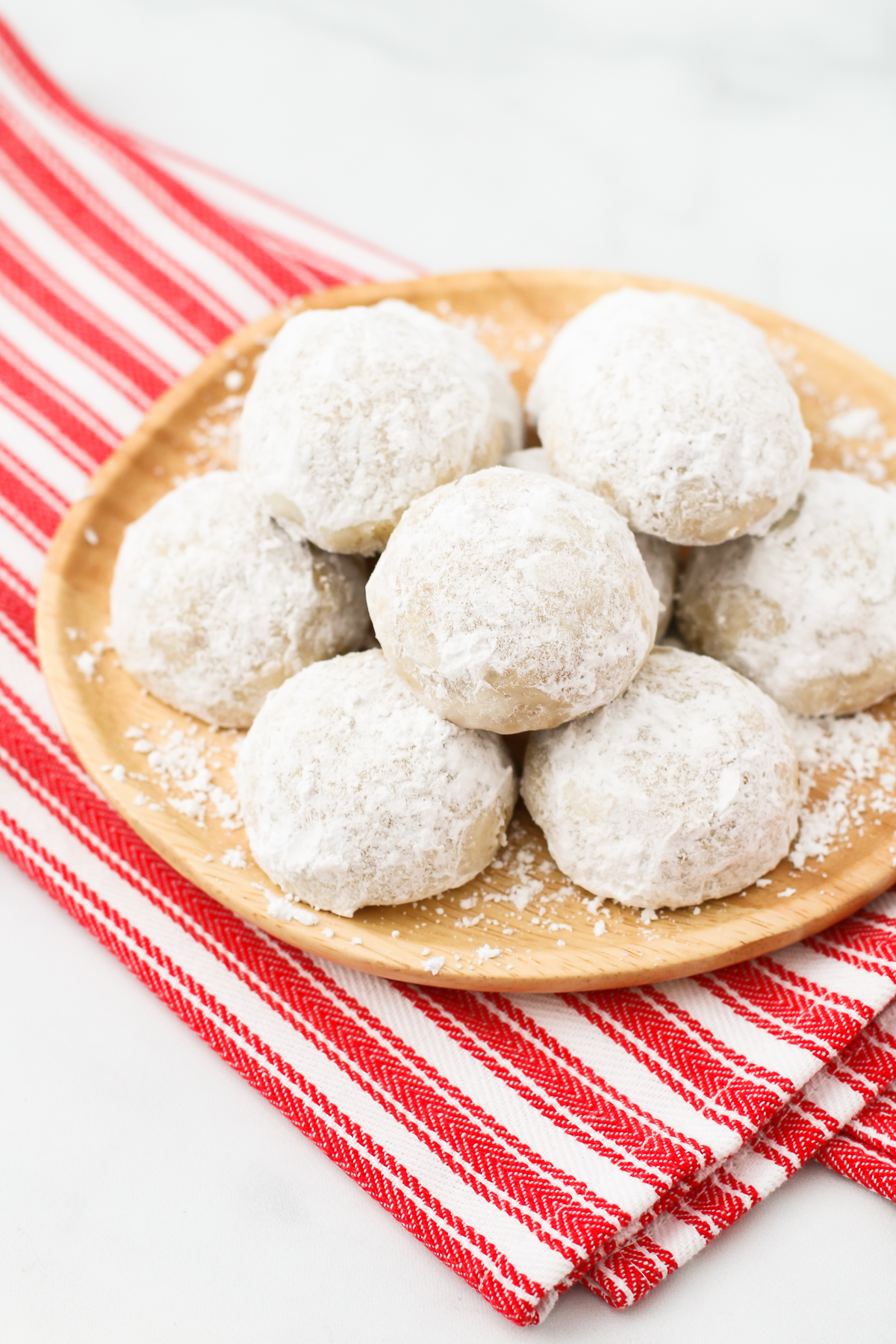 Gluten Free Vegan Snowball Cookies. Also known as Russian tea cakes, these powdered sugar coated cookies are made with flavorful toasted walnuts. A buttery, simple holiday cookie!