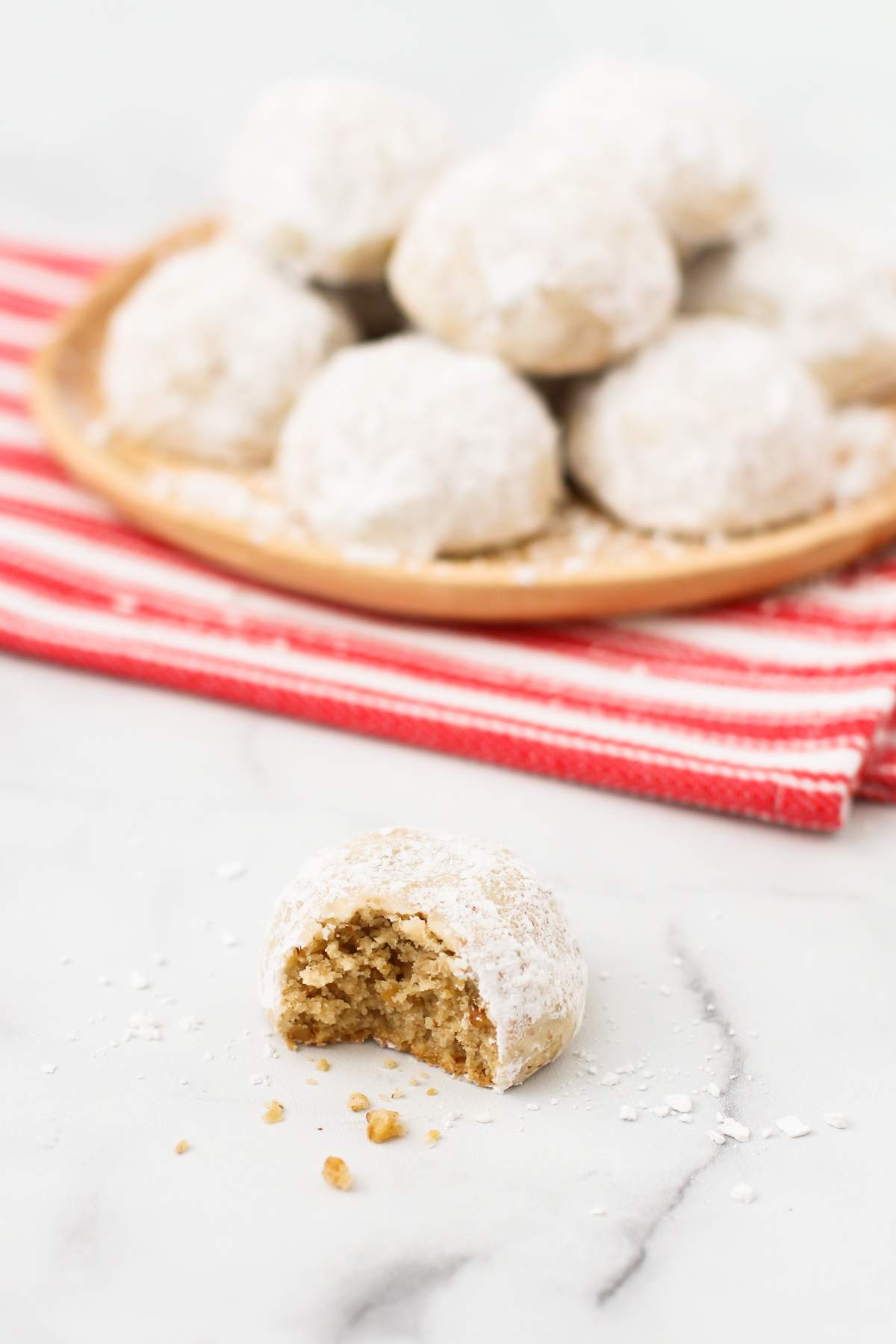 A simple holiday cookie thats made with toasted walnuts and rolled in powdered sugar. Whats not to love about these gluten free vegan snowball cookies?