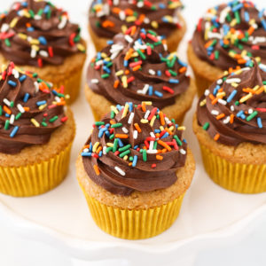 Gluten Free Vegan Vanilla Cupcakes with Chocolate Frosting. The classic flavors of a perfect vanilla cupcake, topped with a rich and creamy chocolate frosting.