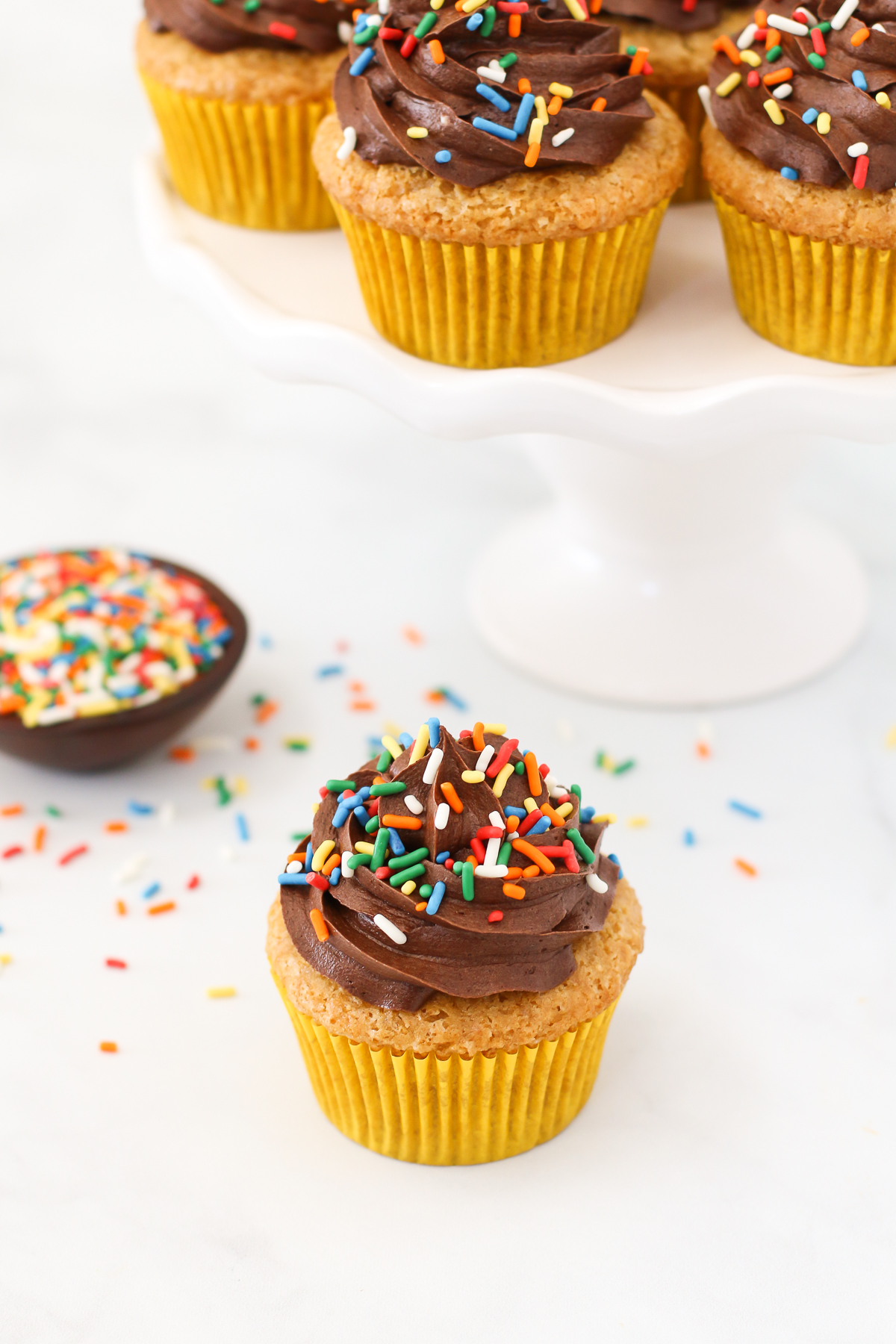 Gluten Free Vegan Vanilla Cupcakes with Chocolate Frosting. The classic chocolate-vanilla combo is sure to make your cupcake dreams come true! 