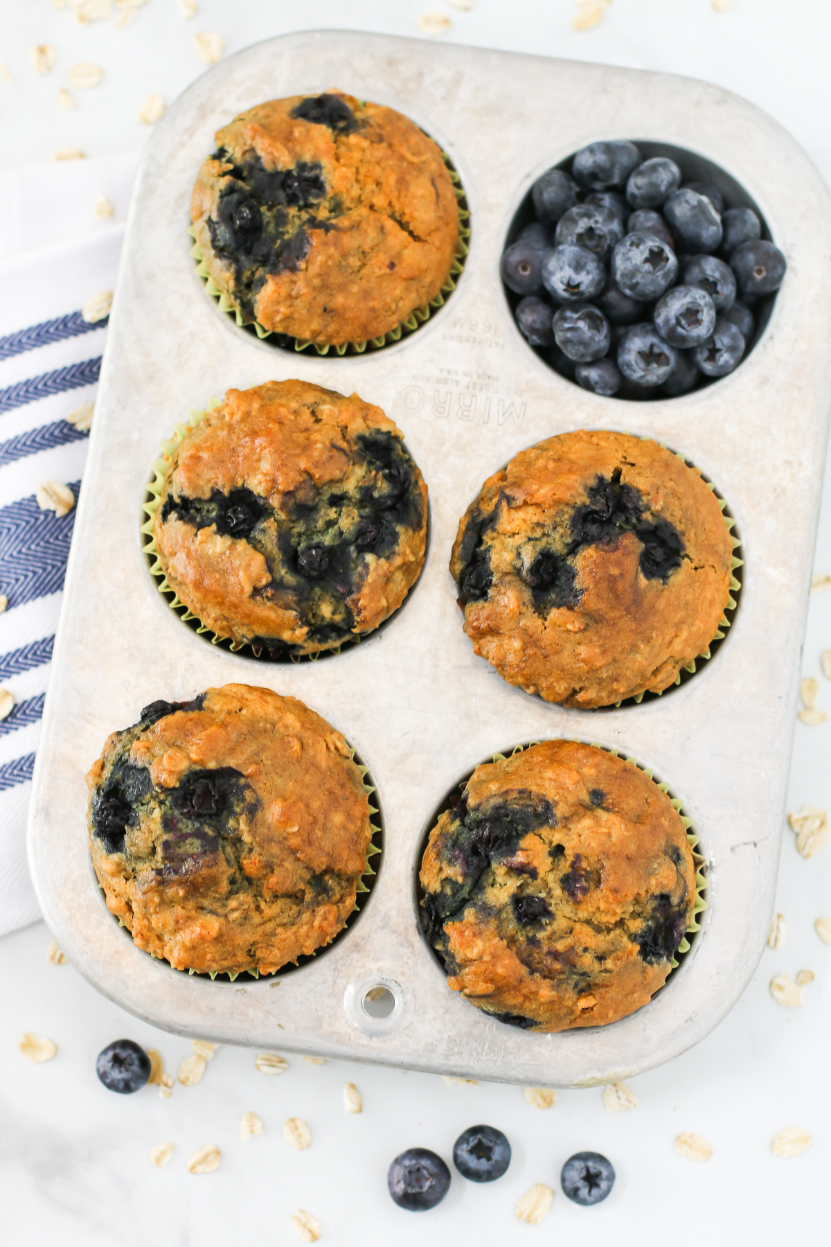 Gluten Free Vegan Blueberry Oatmeal Muffins. Hearty oatmeal muffins, bursting with sweet blueberries.