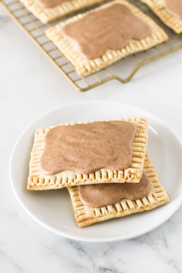 Gluten Free Vegan Brown Sugar Cinnamon Pop Tarts. Buttery pastry, with a cinnamon sugar filling and covered in a sweet cinnamon glaze.