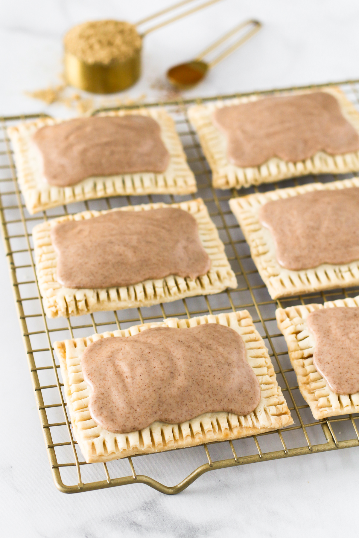 Gluten Free Vegan Brown Sugar Cinnamon Pop Tarts. Homemade buttery pastry, with a cinnamon sugar filling and covered in a sweet cinnamon glaze. 
