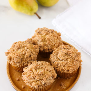 Gluten Free Vegan Pear Crumb Muffins. Tender, spiced muffins with diced fresh pears. A lovely fall breakfast treat!