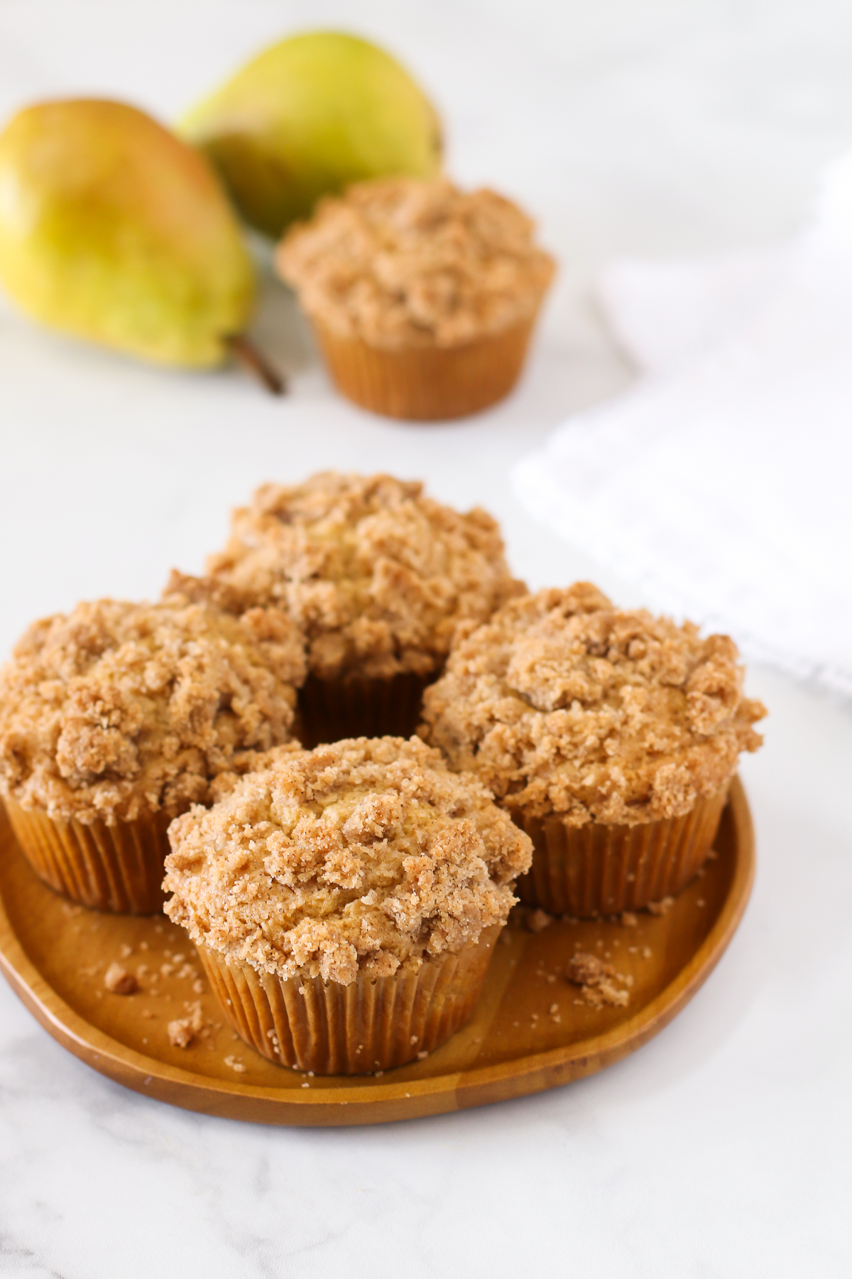 Gluten Free Vegan Pear Crumb Muffins. Tender, spiced muffins with diced fresh pears. A lovely fall breakfast treat!